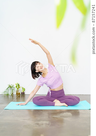 Women doing yoga and flexibility exercises Women doing yoga and flexibility exercises 87157241