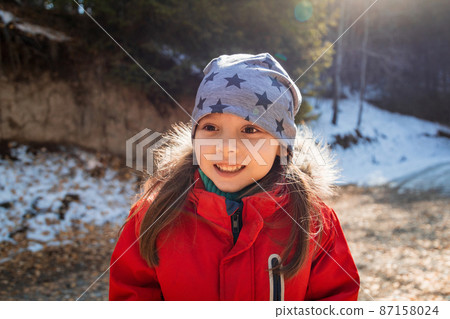 Outdoor portrait of 5 y.o. happy walking girl in autumn sunny day 87158024