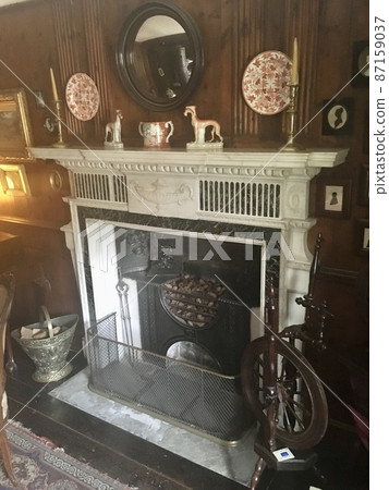 The fireplace of Peter Rabbit's author, Potter's house, in the Lake District, England 87159037