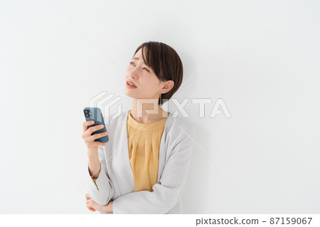 Woman with smartphone 87159067