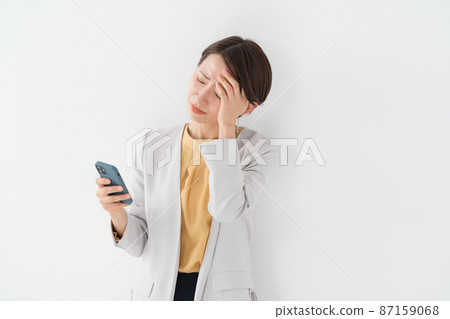 Woman with smartphone 87159068