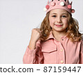 brave girl in a plush crown, close-up portrait 87159447