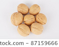Walnuts on a white background lie in the shape of a flower 87159666