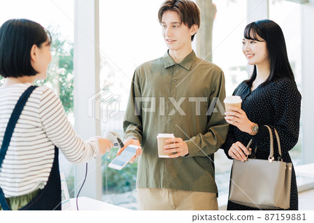 Couple making smartphone payments Couple making smartphone payments 87159881