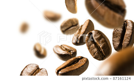 Coffee beans levitate on a white background Coffee beans levitate on a white background 87161124