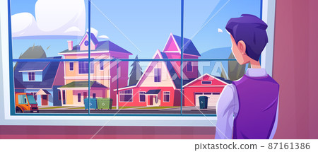 Lonely man at window rear view look on street 87161386