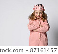 Portrait of a cute girl with a plush crown, stands 87161457