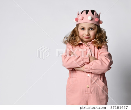 Portrait of a cute girl with a plush crown, stands Portrait of a cute girl with a plush crown, stands 87161457