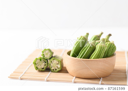 Green okra or ladies fingers (Edible green seed pods), Organic vegetables from local farmer market 87161599