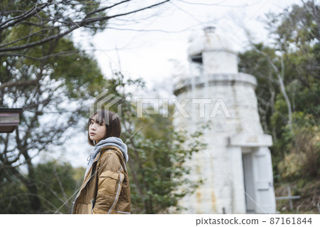 A woman walking over the mountain 87161844