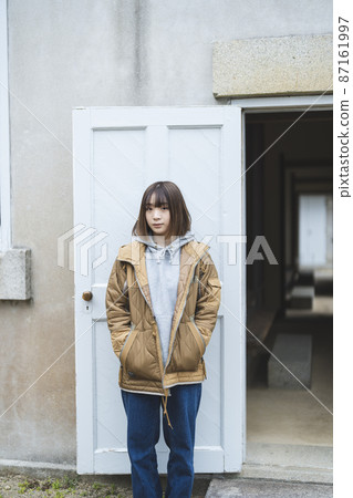 A woman walking around a tourist spot 87161997