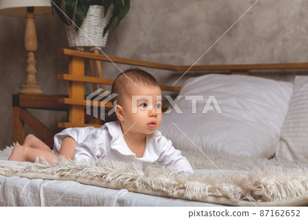 little baby girl standing on all fours. little baby girl standing on all fours. 87162652