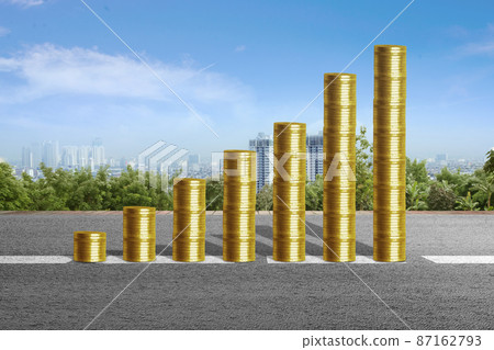 Stack of gold coins on the street 87162793