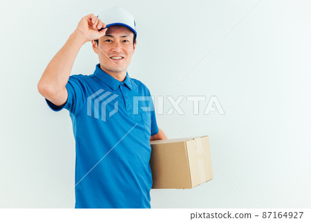 Men in work clothes with cardboard Men in work clothes with cardboard 87164927