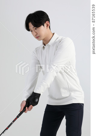 golf sports player, asian korean man with golf club in studio golf sports player, asian korean man with golf club in studio 87165539