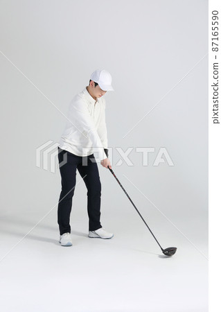 golf sports player, asian korean man with golf club in studio golf sports player, asian korean man with golf club in studio 87165590