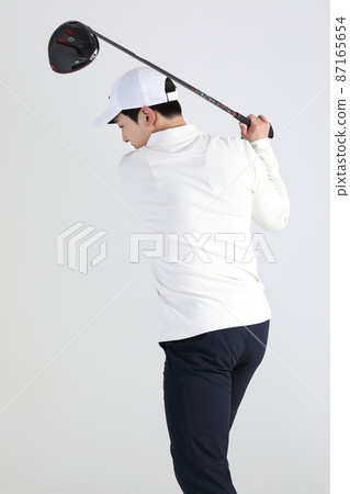golf sports player, asian korean man with golf club in studio golf sports player, asian korean man with golf club in studio 87165654