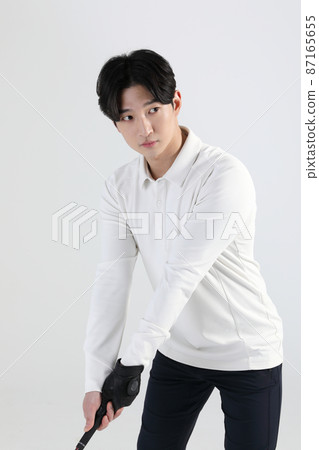 golf sports player, asian korean man with golf club in studio golf sports player, asian korean man with golf club in studio 87165655