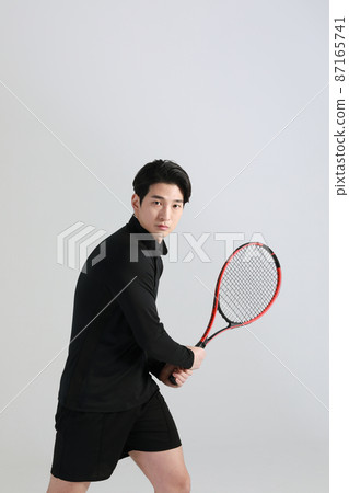 tennis sports player, asian korean man with racket, studio tennis sports player, asian korean man with racket, studio 87165741