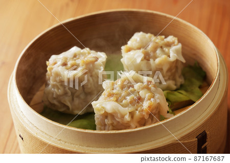 Delicious pork dumplings in a bamboo steamer 87167687