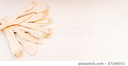 Eco friendly wooden cutlery.plastic free concept.Disposable wooden cutlery.Eco concept.Banner eco friendly disposable kitchenware .Wooden forks,spoons,zero waste.Copy space. 87169351