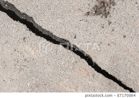 Large crack stratification separation of asphalt road broken damaged stone surface Large crack stratification separation of asphalt road broken damaged stone surface 87170864