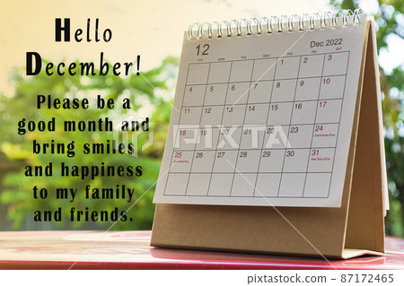 White December 2022 calendar on green background with text. New Year Concept White December 2022 calendar on green background with text. New Year Concept 87172465