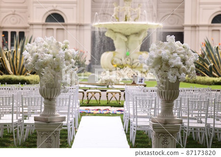 An image of a gorgeous wedding ceremony outdoors with perfect infection control An image of a gorgeous wedding ceremony outdoors with perfect infection control 87173820