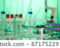 Stethoscope on Chemical Lab - Labs Photo in Green Colors 87175229