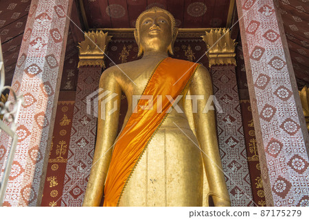 Big standing Buddha statue in Wat Sensoukaram, Luang Prabang, Laos. This Buddha is the tallest Buddha statue in Luang Prabang. 87175279