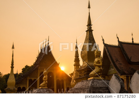 Beautiful sunset with old temple in Luang Prabang the UNESCO world heritage town in north central of Laos. 87175280