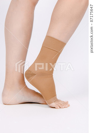 Orthopedic Ankle Brace. Medical Ankle Bandage. Medical Ankle Support Strap Adjustable Wrap Bandage Brace foot Pain Relief Sport. Leg Brace isolated on white background. Trauma Ankle orthosis. Injury. 87175647