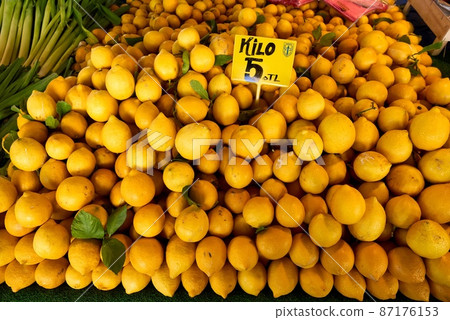 Fresh Sicilian lemons at food street market citrus fruit background. Fresh Sicilian lemons at food street market citrus fruit background. 87176153