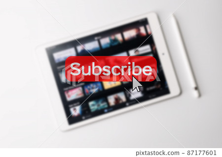 Subscription plan. Red online video subscribe button. Internet service on laptop digital tablet blured technology background. Visual contents concept. Social networking service. 87177601