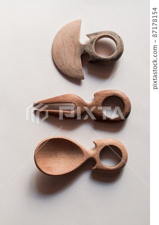 Handmade Wooden Spoons for hiking and outdoor activities. Craftsmanship and artisan concept Handmade Wooden Spoons for hiking and outdoor activities. Craftsmanship and artisan concept 87178154