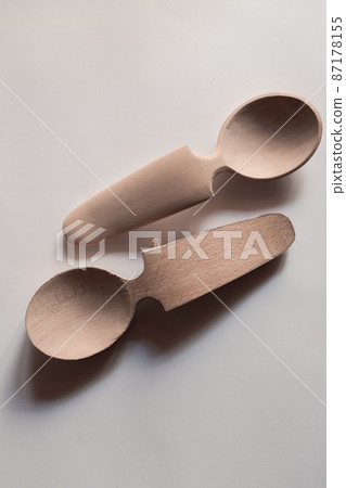 Handmade Wooden Spoons for hiking and outdoor activities. Craftsmanship and artisan concept Handmade Wooden Spoons for hiking and outdoor activities. Craftsmanship and artisan concept 87178155