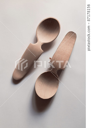 Handmade Wooden Spoons for hiking and outdoor activities. Craftsmanship and artisan concept Handmade Wooden Spoons for hiking and outdoor activities. Craftsmanship and artisan concept 87178156
