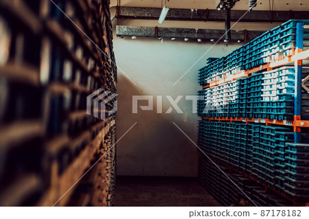 Gold mining storage rock core samples geology drilling industy. Large ore warehouse in modern industry, ores stacked in boxes. Selective focus Gold mining storage rock core samples geology drilling industy. Large ore warehouse in modern industry, ores stacked in boxes. Selective focus 87178182