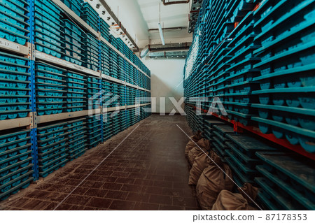 Gold mining storage rock core samples geology drilling industy. Large ore warehouse in modern industry, ores stacked in boxes. Selective focus  87178353