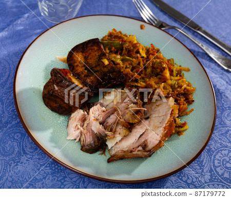 Appetizing pork with potatoes and stewed cabbage 87179772