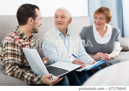 Aged couple signing agreement Aged couple signing agreement 87179848