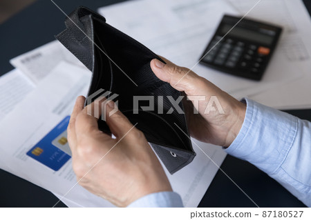 Close up view old woman opening empty wallet. Close up view old woman opening empty wallet. 87180527