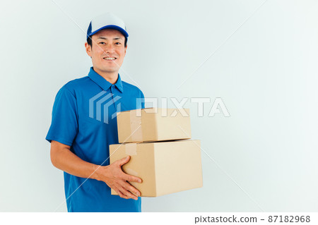 Men in work clothes with cardboard Men in work clothes with cardboard 87182968