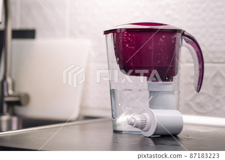 Water filter plastic jug with a new replaceable cartridge. Replaceable module, or cartridge for cleaning tap water Water filter plastic jug with a new replaceable cartridge. Replaceable module, or cartridge for cleaning tap water 87183223
