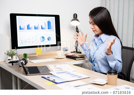 Working Asian women feel stressed, tired from work, migraine headaches from hard work while working at the office 87183816