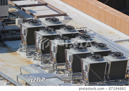 the Air compressor machine on pedestal with building background 87184862