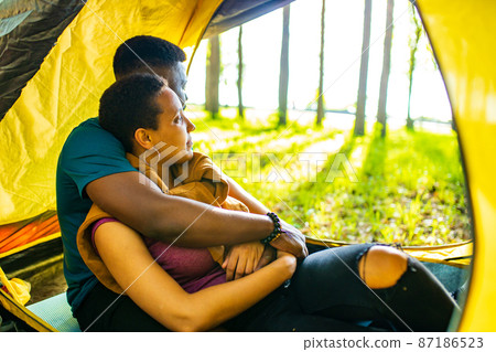 two happy person feeling love to each other having outdoor weekends at picnic in forest two happy person feeling love to each other having outdoor weekends at picnic in forest 87186523