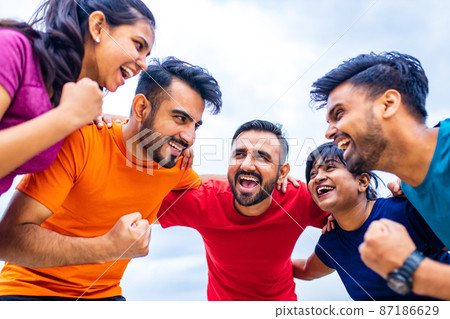 four indian people warming up outdoors in sport wear morning time urban 87186629