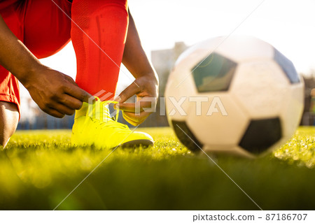 authentic happy football trainer working out outdoor in summer great day 87186707