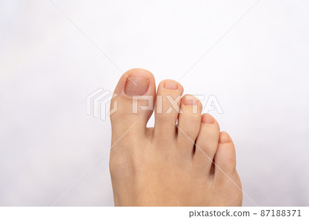 Closeup of female feet and toes. Healthy feet concept 87188371